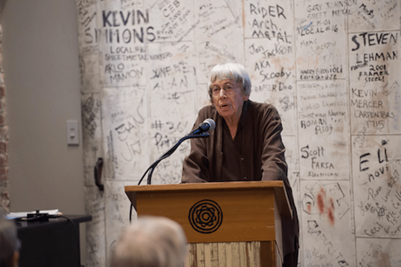 Ursula at podium speaking